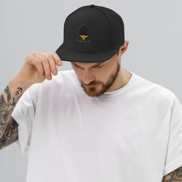 A man wearing the black Duckster snapback with the embroidered duck logo on the front.